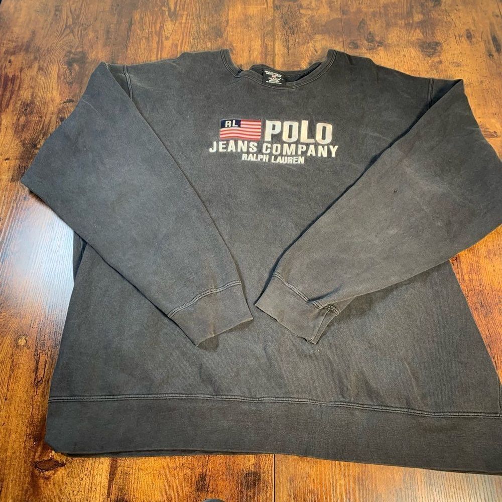 Some small holes on one sleeve. Few stains‎ on the back.
